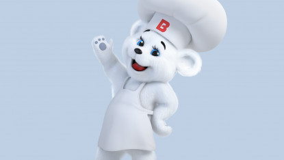 A cartoon bear in a chef hat and apron cheerfully waves on a light blue background. The hat has a red "B" on it. The tone is playful and friendly.