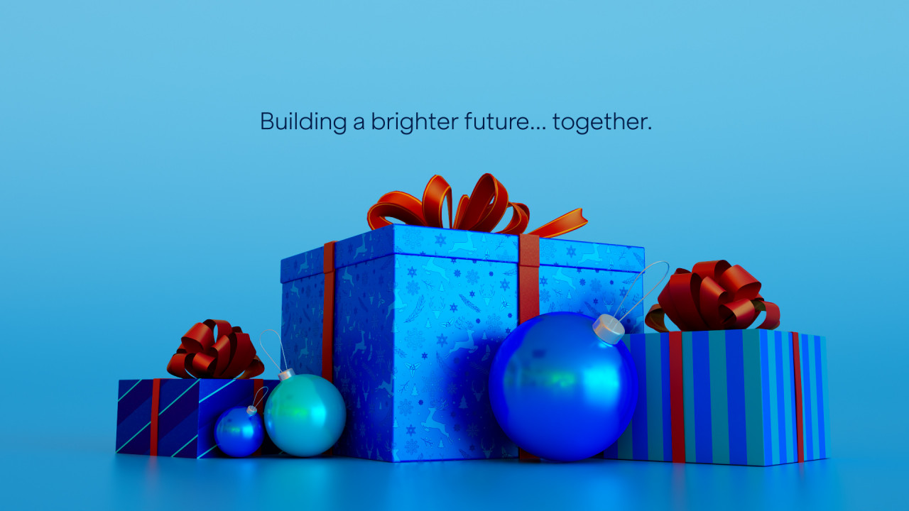Festive blue gift boxes with red bows and ornaments, symbolizing unity and hope.